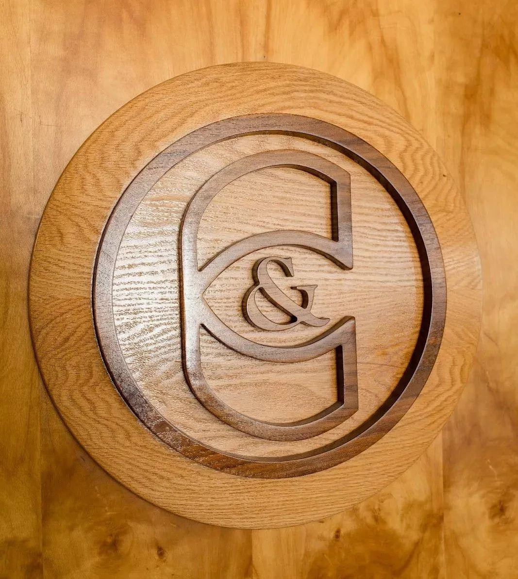 The Carlozo & Company monogram carved in wood